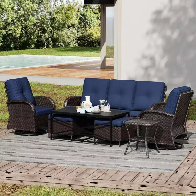 Conjunto de patio exterior de 7 piezas UPTIOT con sofá de 3 asientos, dos sillones giratorios, otomanas, mesa de centro y mesas auxiliares