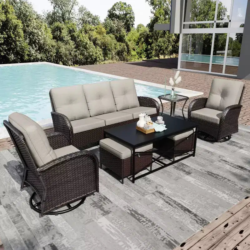 Conjunto de patio exterior de 7 piezas UPTIOT con sofá de 3 asientos, dos sillones giratorios, otomanas, mesa de centro y mesas auxiliares