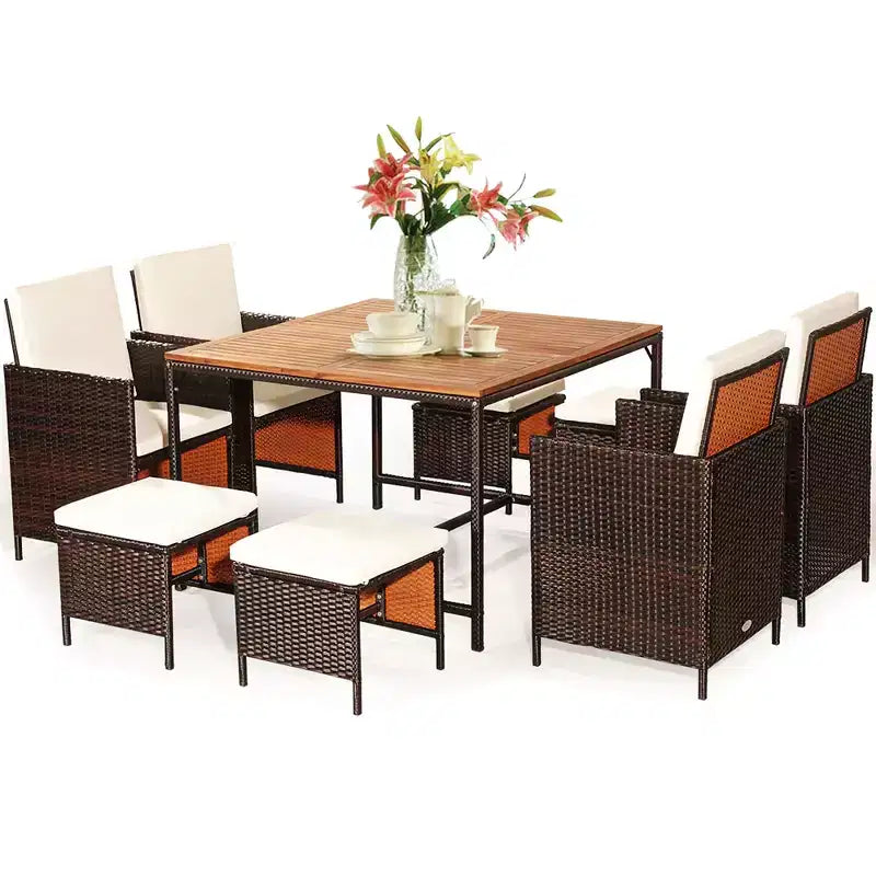 Juego de comedor de patio de ratán de madera de acacia Costway de 9 piezas con sillas acolchadas y otomanas
