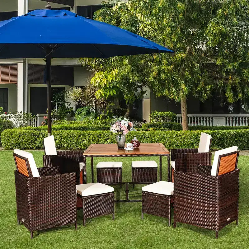 Juego de comedor de patio de ratán de madera de acacia Costway de 9 piezas con sillas acolchadas y otomanas