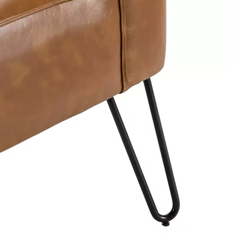 Sillón auxiliar contemporáneo de cuero vegano capitoné con patas de metal en forma de U