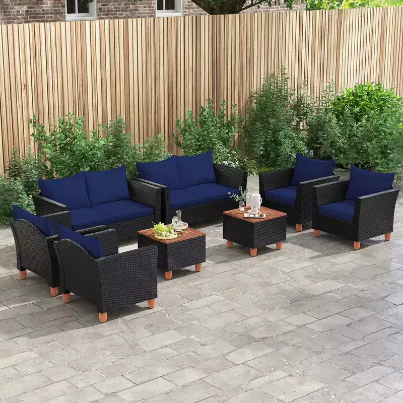 Juego de muebles de patio de mimbre Costway de 4 piezas con cojines extraíbles, mesa de centro de almacenamiento, blanco/azul marino/gris