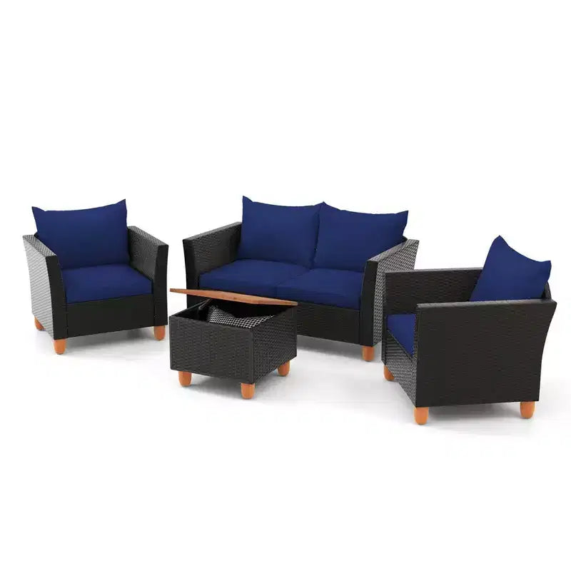 Juego de muebles de patio de mimbre Costway de 4 piezas con cojines extraíbles, mesa de centro de almacenamiento, blanco/azul marino/gris
