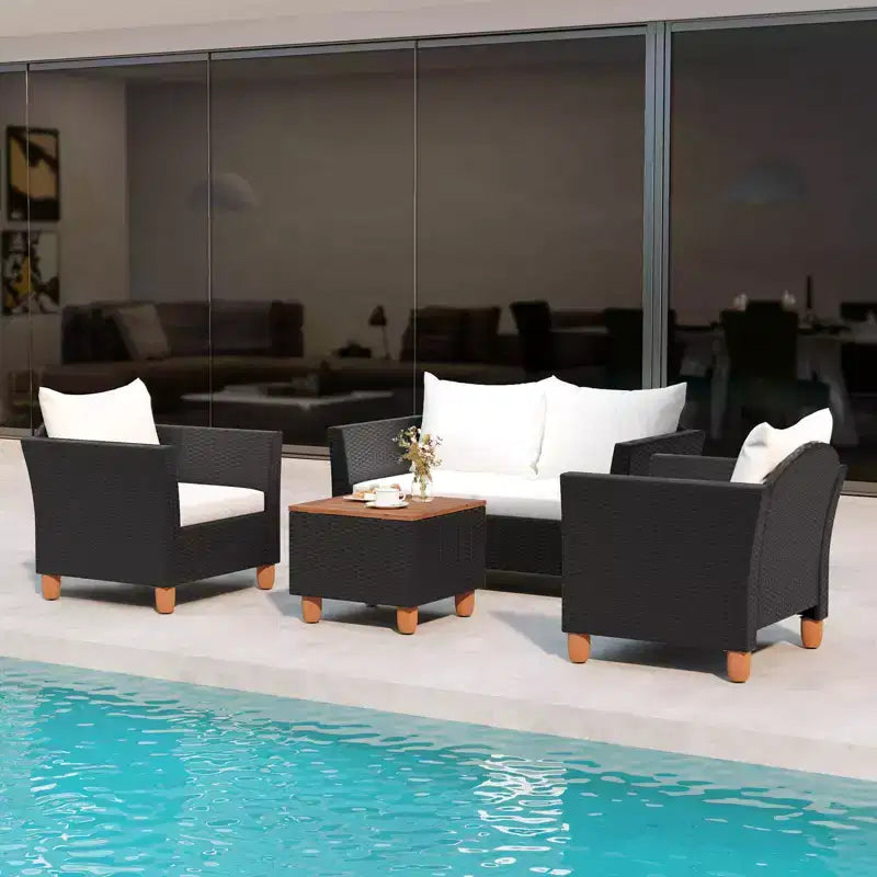 Juego de muebles de patio de mimbre Costway de 4 piezas con cojines extraíbles, mesa de centro de almacenamiento, blanco/azul marino/gris