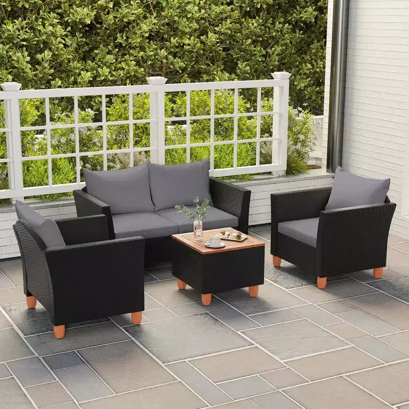 Juego de muebles de patio de mimbre Costway de 4 piezas con cojines extraíbles, mesa de centro de almacenamiento, blanco/azul marino/gris