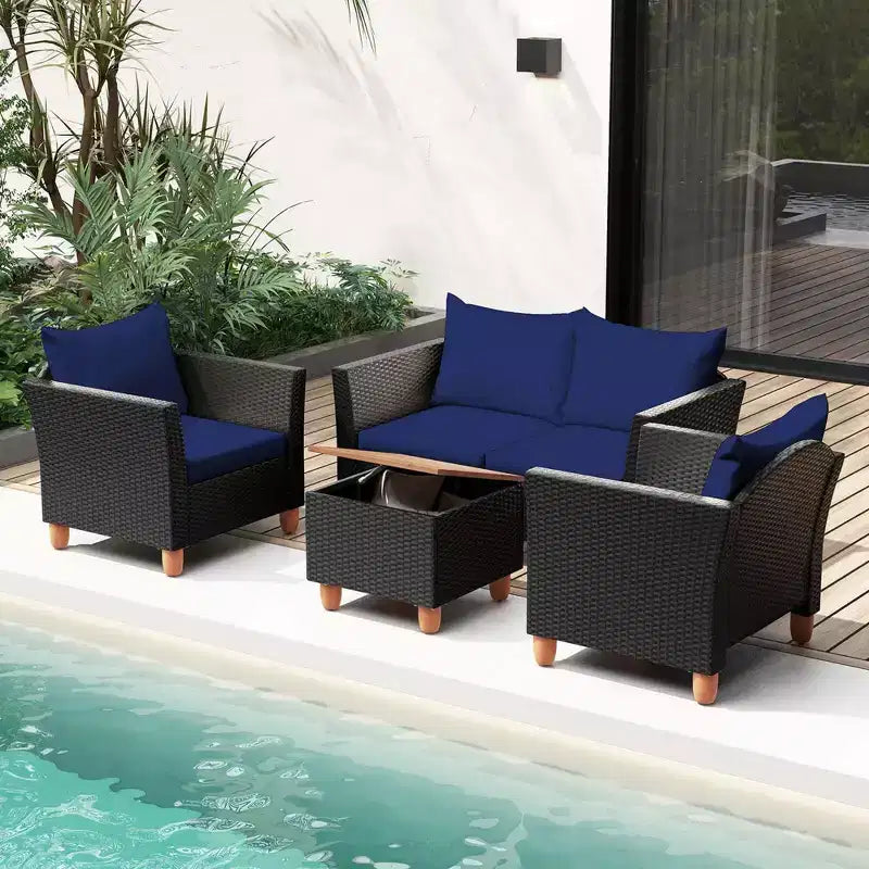 Juego de muebles de patio de mimbre Costway de 4 piezas con cojines extraíbles, mesa de centro de almacenamiento, blanco/azul marino/gris